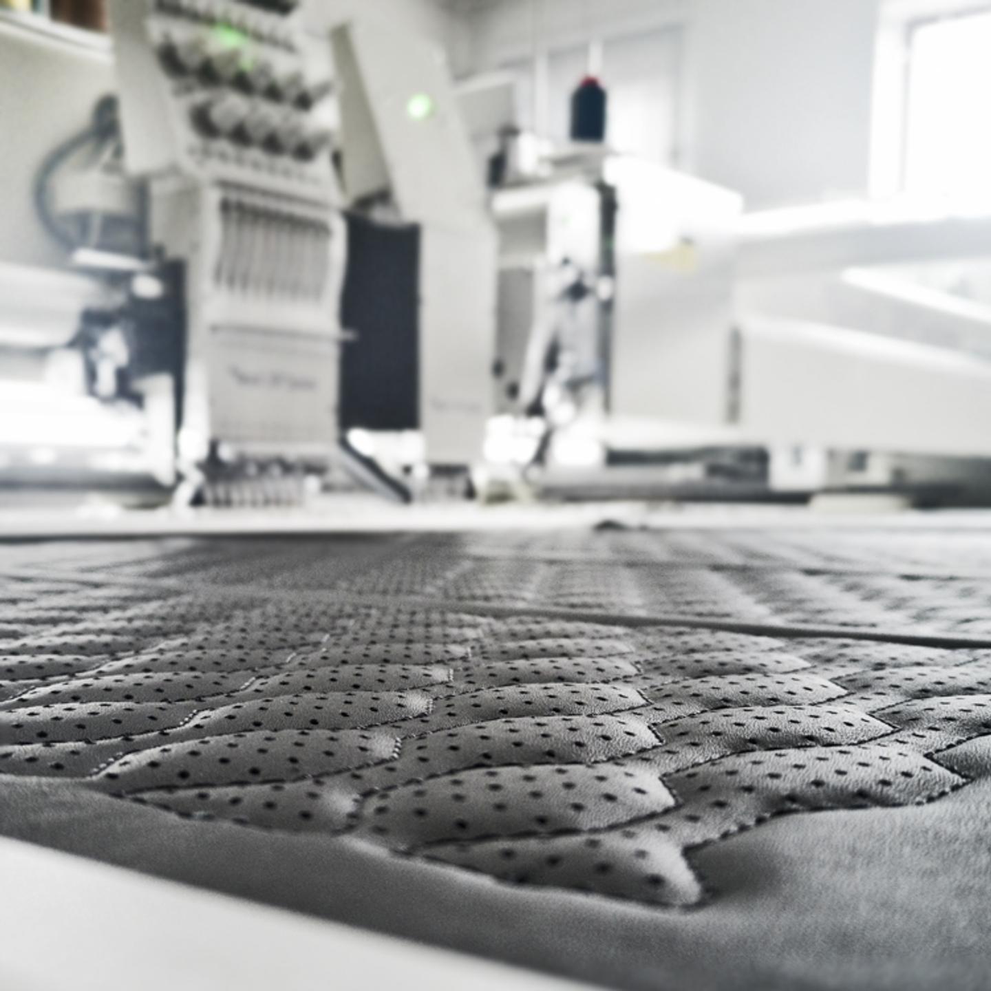 Multifunctional machine for sewing, embroidering and perforating leather and coated fabrics