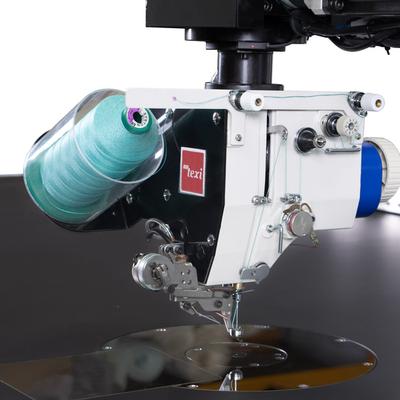 Maszyna do stebnowania programowanych wzorów z podnoszoną i obrotową głowicą szyjącą - maszyna kompletna