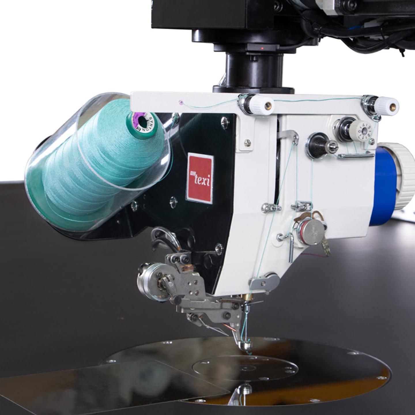 Programmable sewing machine with liftable rotary sewing head and independent drives with extra large sewing field