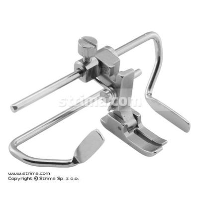 Needle feed foot with right and left gauges